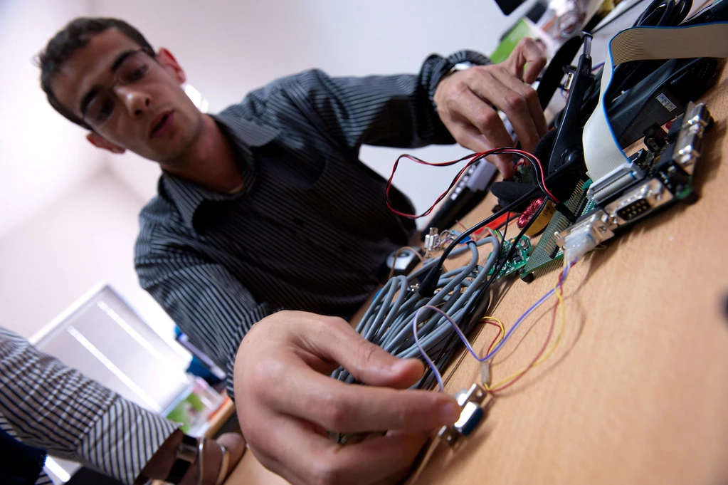 Electrical Engineer at workstation.